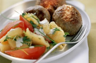 Potato salad with meatballs