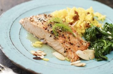 Baked salmon fillet with spinach and rice