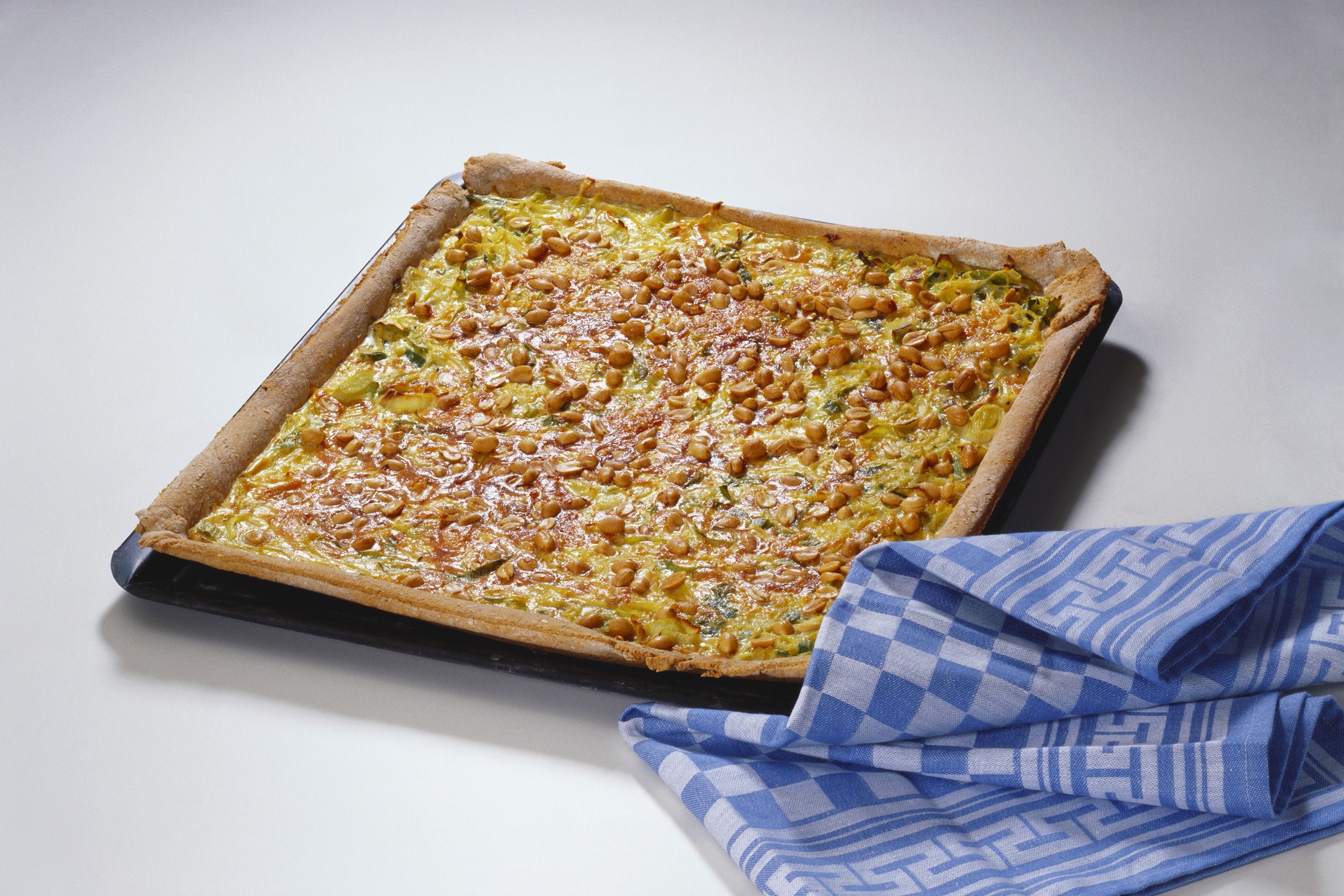 onion-and-leek-tart-with-cheese-and-peanuts-freshmag