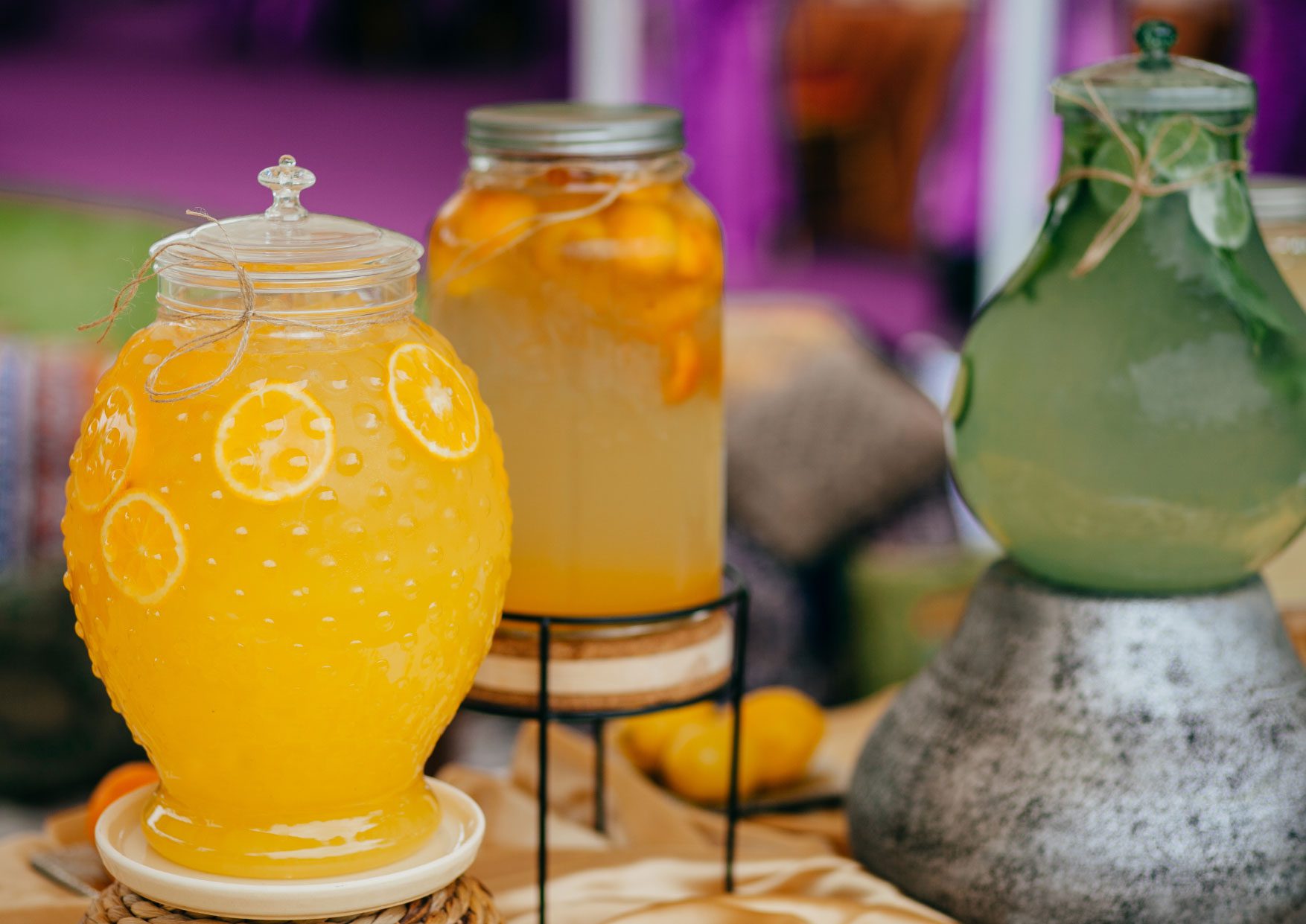 Cold refreshing fruit juice in glass jars with a tap. Stock Photo by  ©Huldiberdiev 278083658