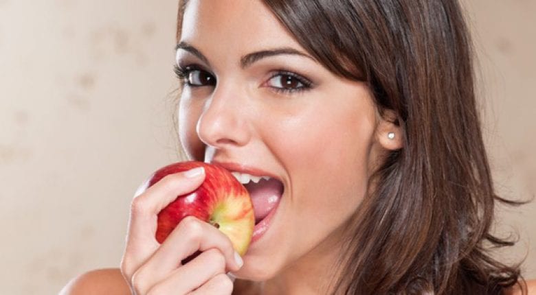 Apple bitten by a woman