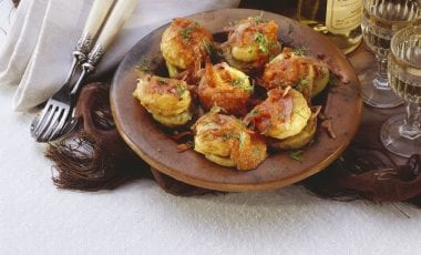 Baked eggs on aubergine slices with bacon